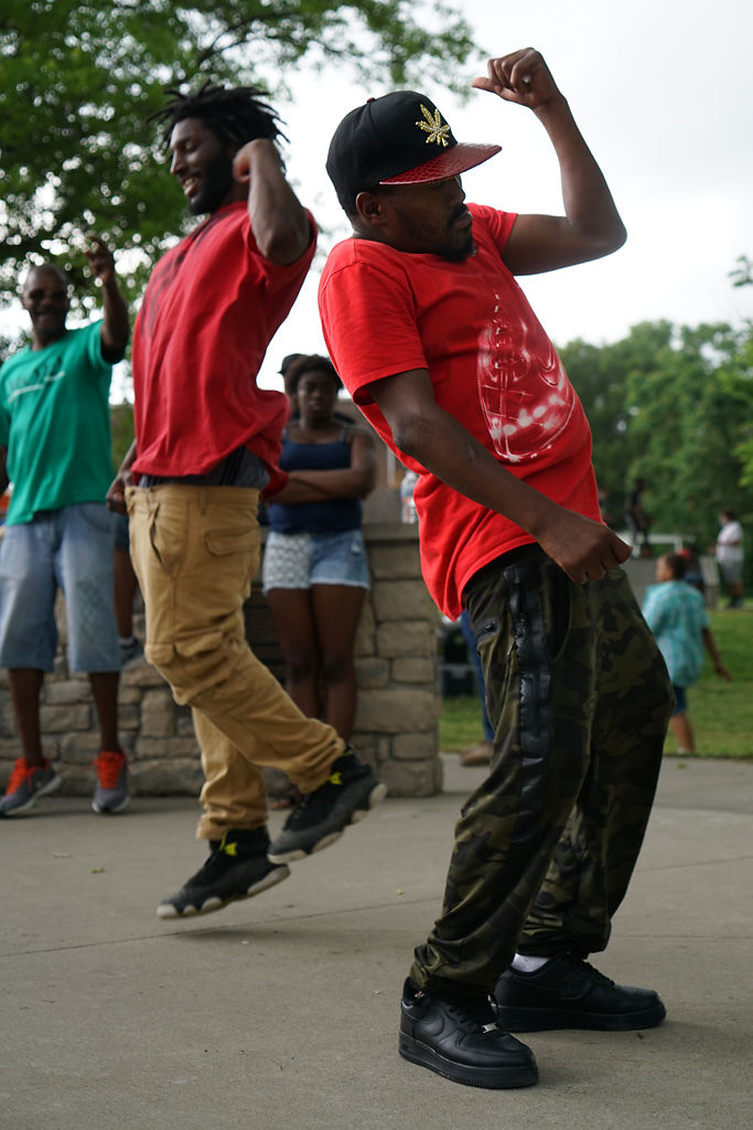 Chlaru, right, and Otis Campbell dance along the music at Douglass Park on Friday,
